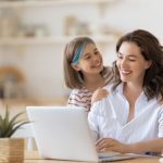 happy women with young child