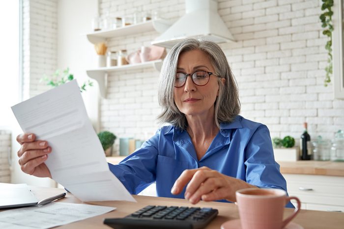 unhappy wife calculating money