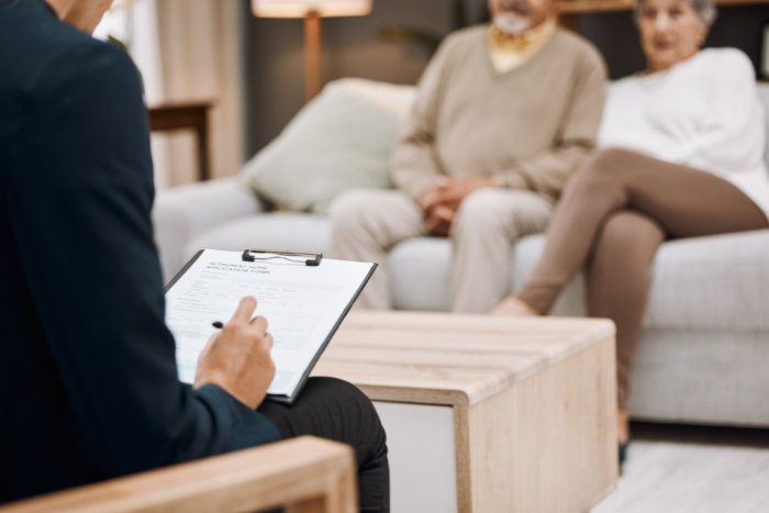 Couple sat talking with solicitor about a divorce and consent order