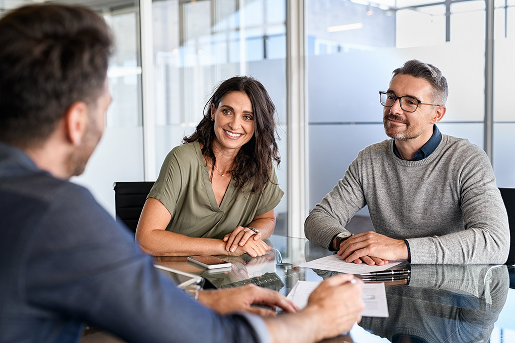 couple negotiate prenup with solicitor