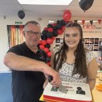 Mark Keenan cutting a 25th anniverary cake for divorce-online
