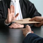 Judge in a courtroom shaking their head and refusing to approve a financial consent order, highlighting the rejection of DIY divorce agreements